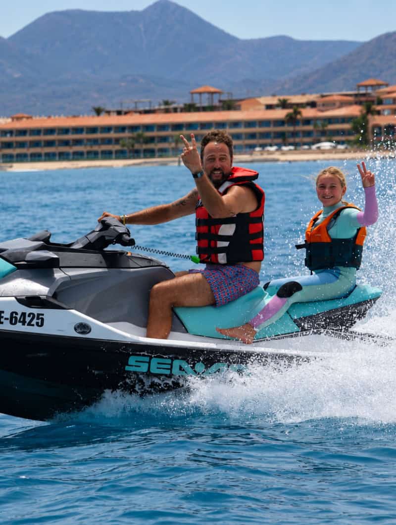 Father and daughter sharing a guided jet ski ride near Corralejo in Fuerteventura.