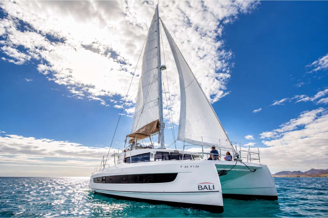 Luxury Bali 4.2 catamaran sailing on clear turquoise waters off the coast of Fuerteventura during a private charter from Corralejo.