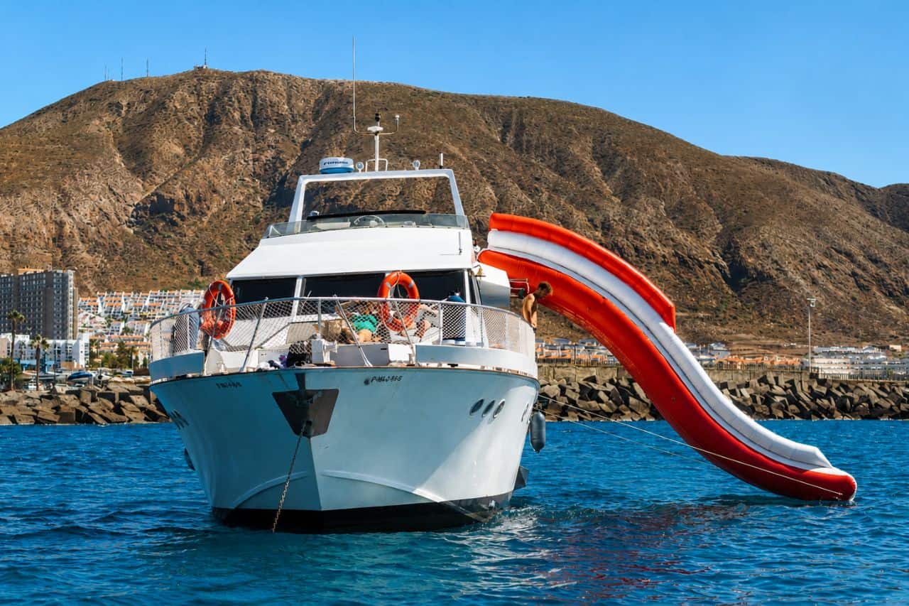 Gulliver boat Tenerife with water slide and large deck space for a fun private charter