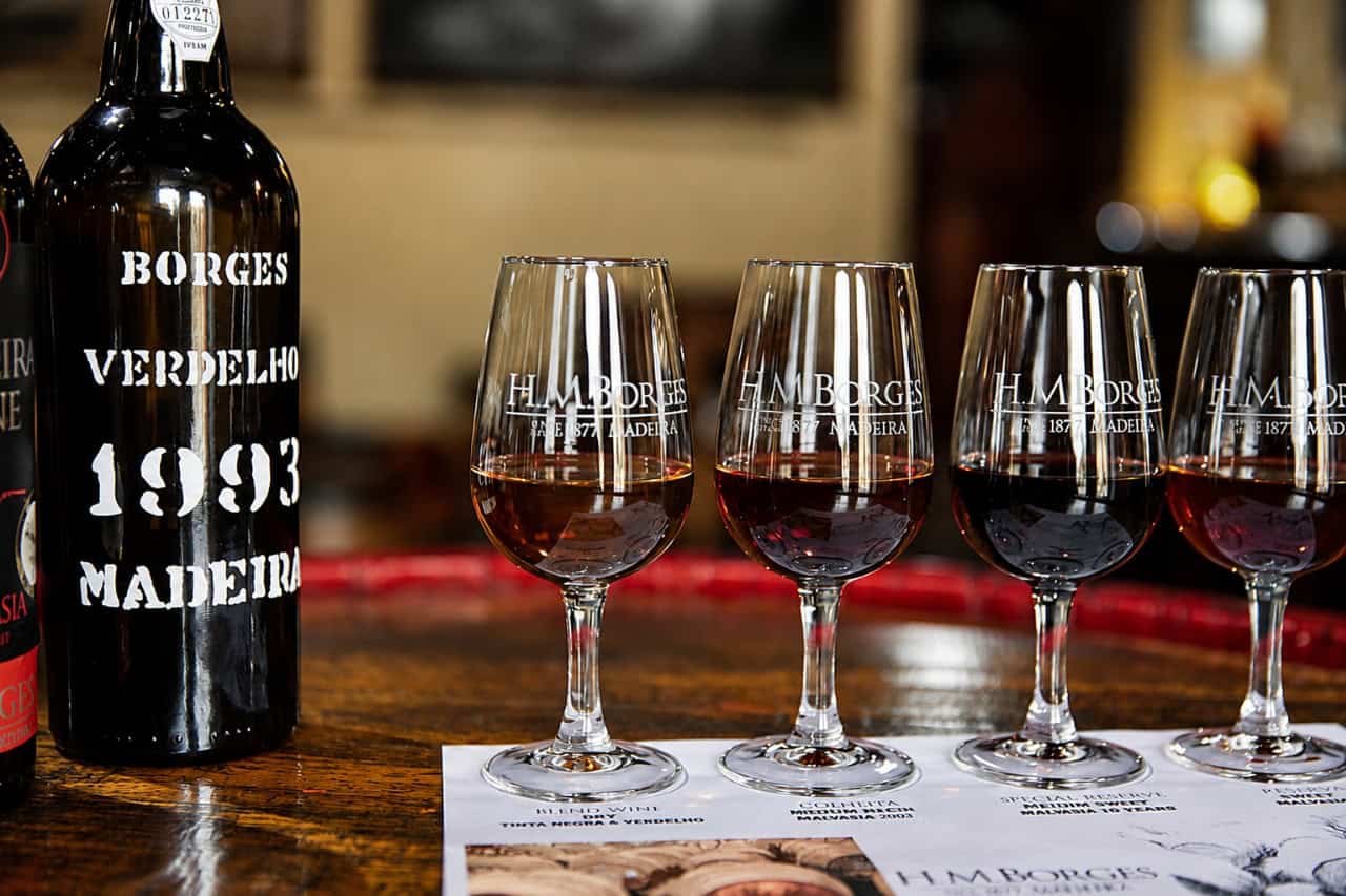 Glasses of aged Madeira wine lined up for a premium tasting