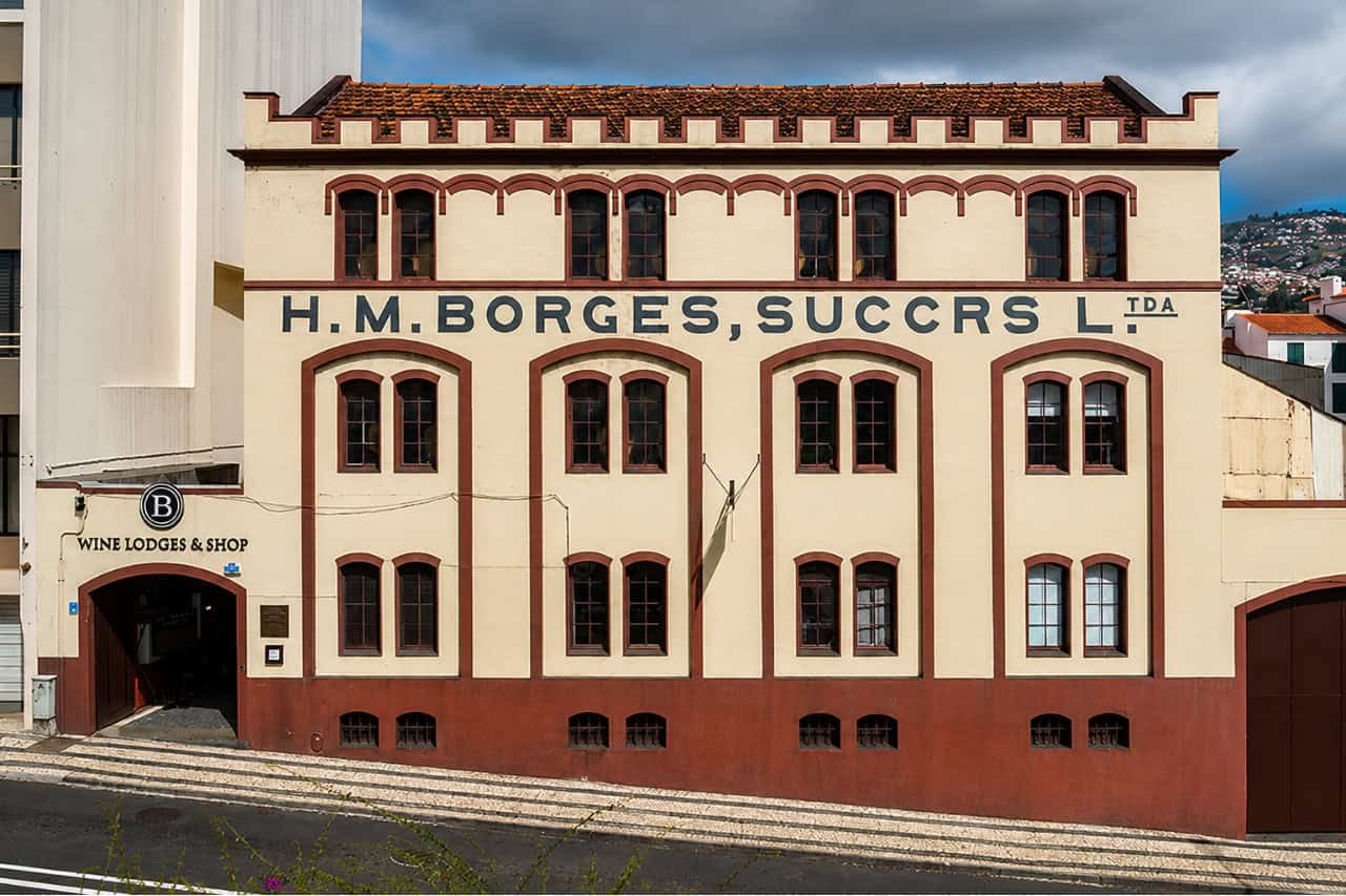 Facade of the historic H.M. Borges wine lodge in Funchal, Madeira