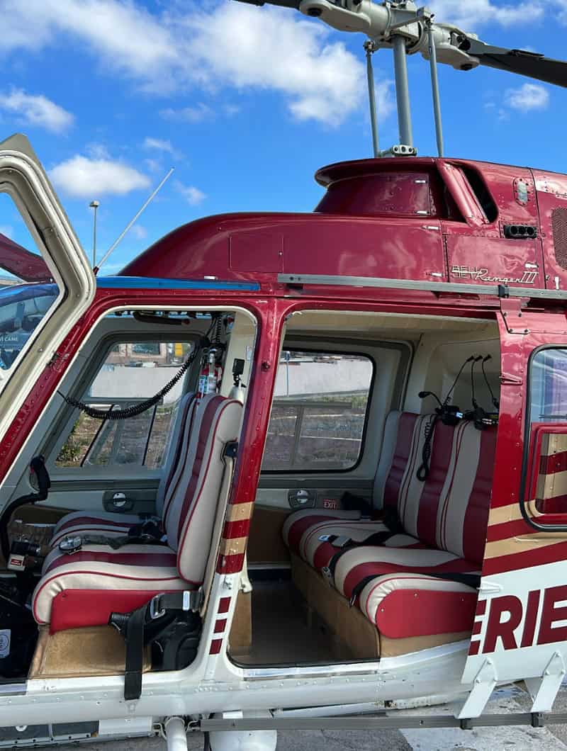 Open helicopter doors showing the seats before a helicopter ride Tenerife
