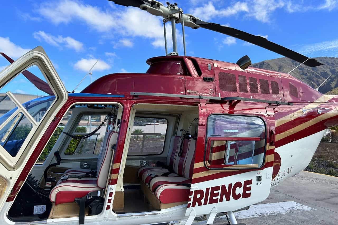 Helicopter tour Tenerife boarding area with open doors before scenic flight from Adeje.