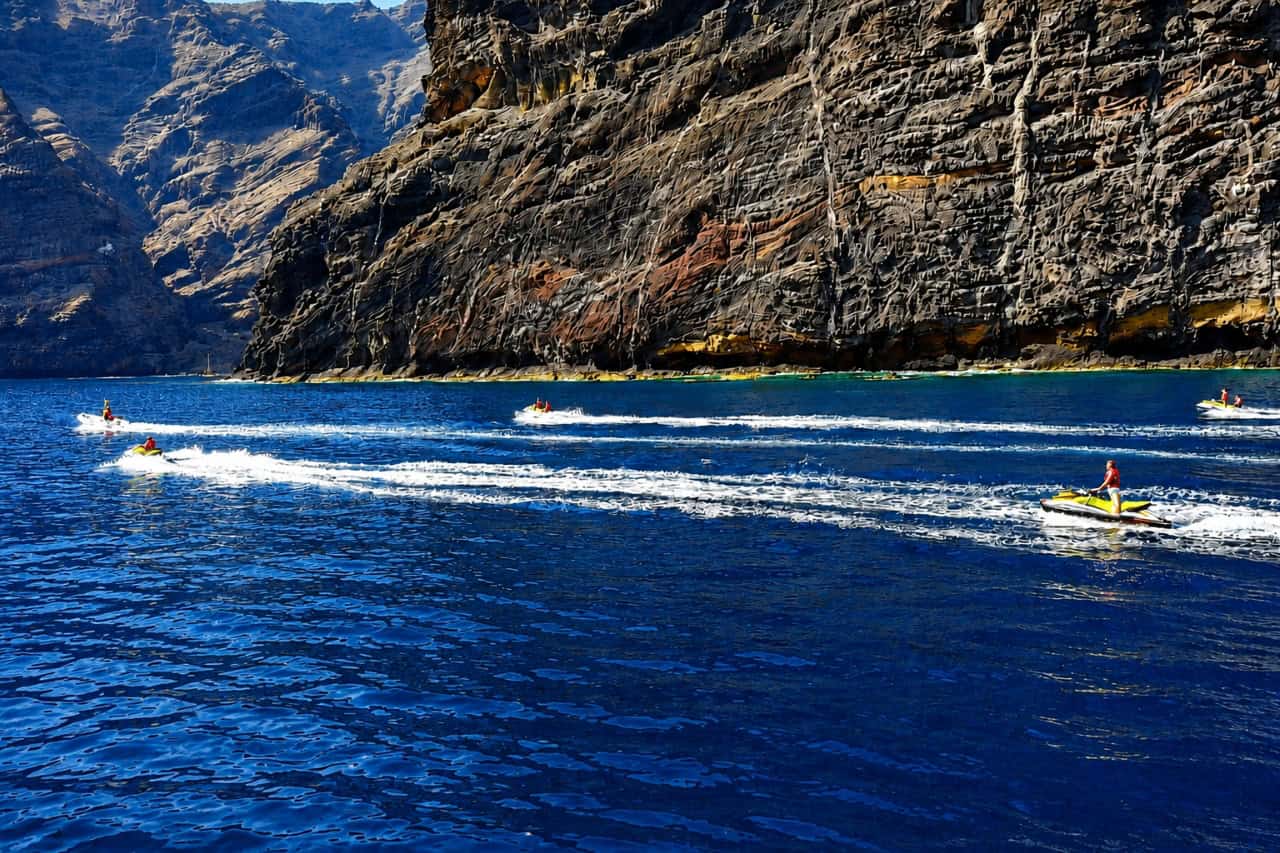 Jet ski trip from Los Gigantes with riders travelling beside the dramatic volcanic cliffs on the west coast of Tenerife.