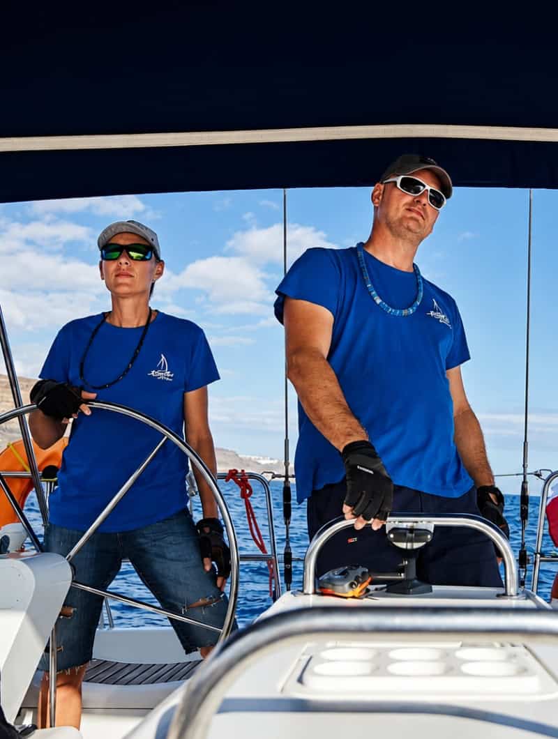Guests relaxing on deck during a private Karolka yacht charter along the south coast of Gran Canaria