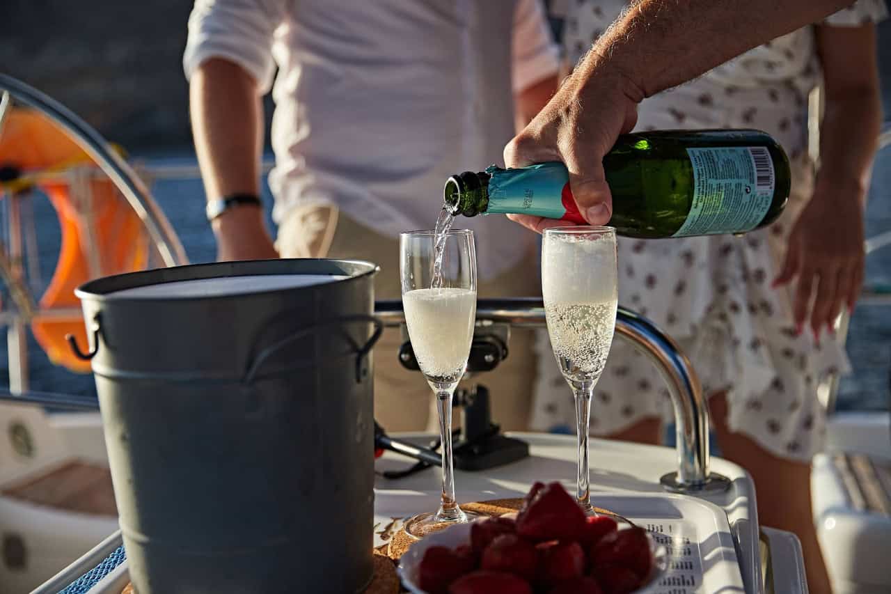 Champagne poured on board the Karolka sailing yacht in Puerto de Mogán, Gran Canaria