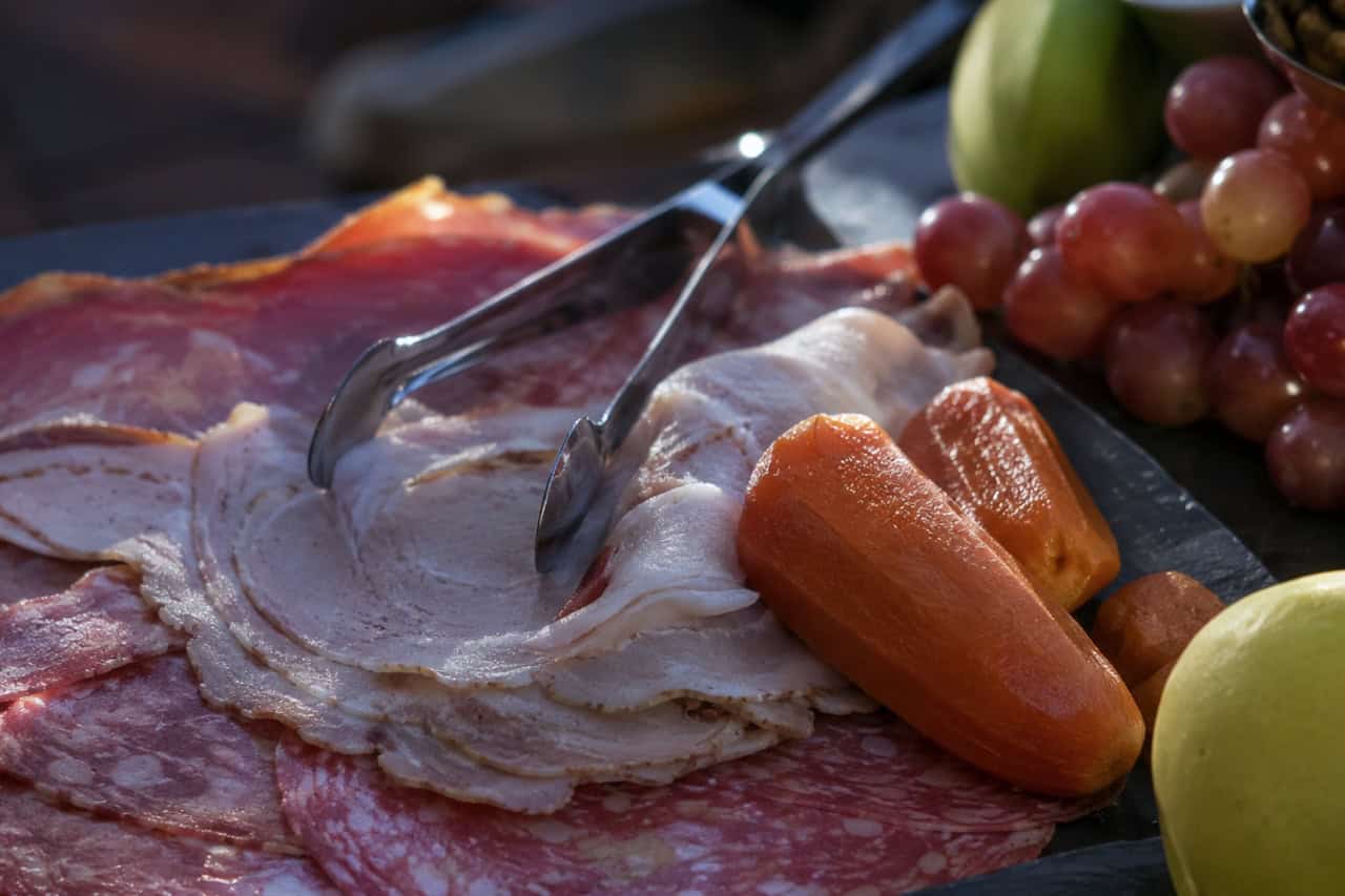 Selection of cured meats, fresh fruit, and local snacks served during the Mount Teide Stargazing Tour in Tenerife.