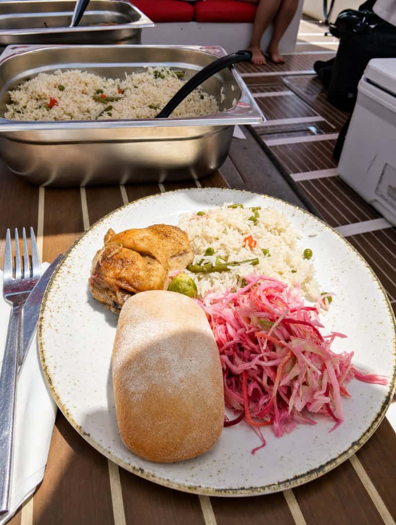 Chicken, rice, salad and bread served during the shared Opera 60 boat excursion in Tenerife