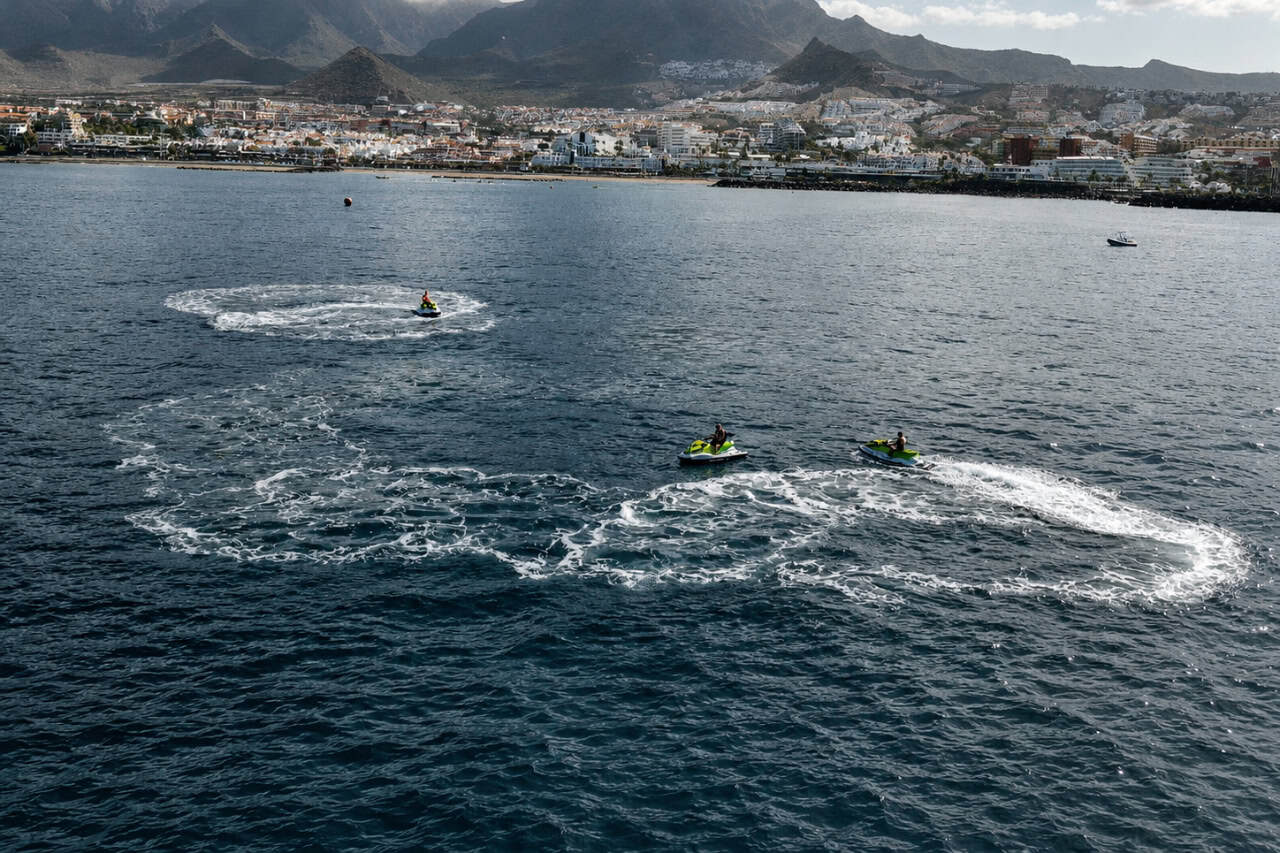 Private jet ski trip in Tenerife with riders exploring the coastline near Costa Adeje and enjoying an exclusive ocean experience.