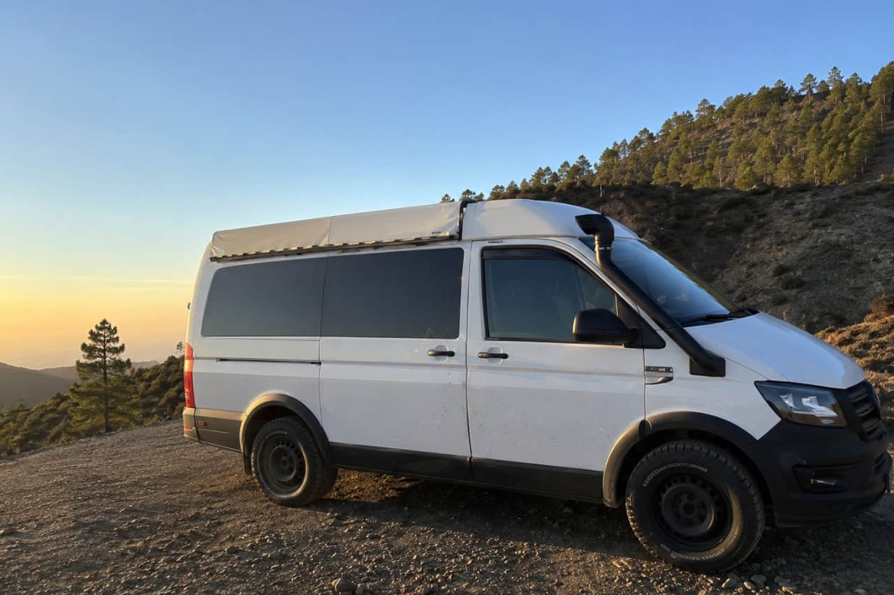Comfortable minivan used for hotel pickup and transport during the Mount Teide Stargazing Tour in Tenerife, parked in the mountains before the evening astronomy experience.