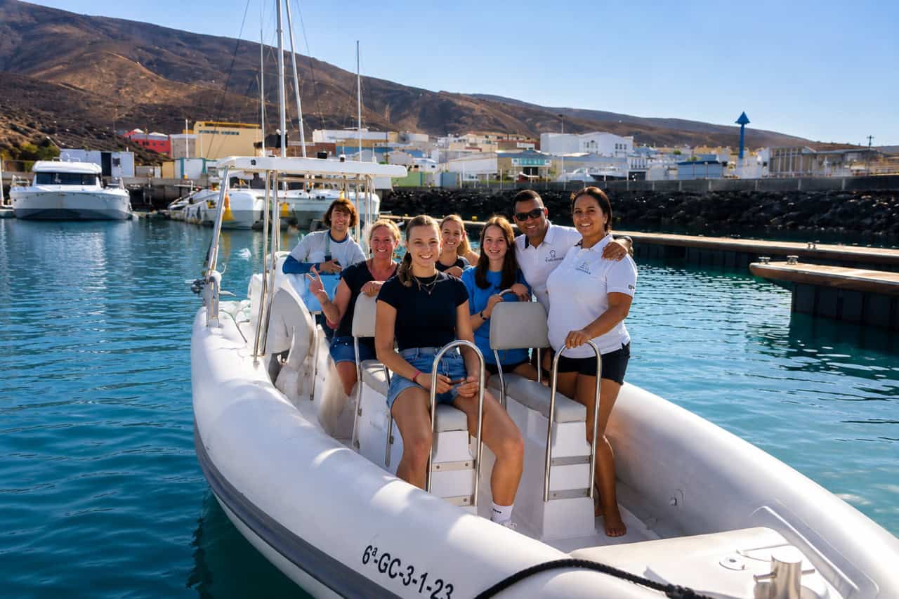 Guests boarding a private dolphin watching boat in Morro Jable Marina, Fuerteventura