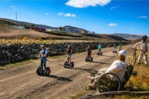 Group of visitors riding Segways along a scenic countryside trail during a guided Segway tour in Fuerteventura.