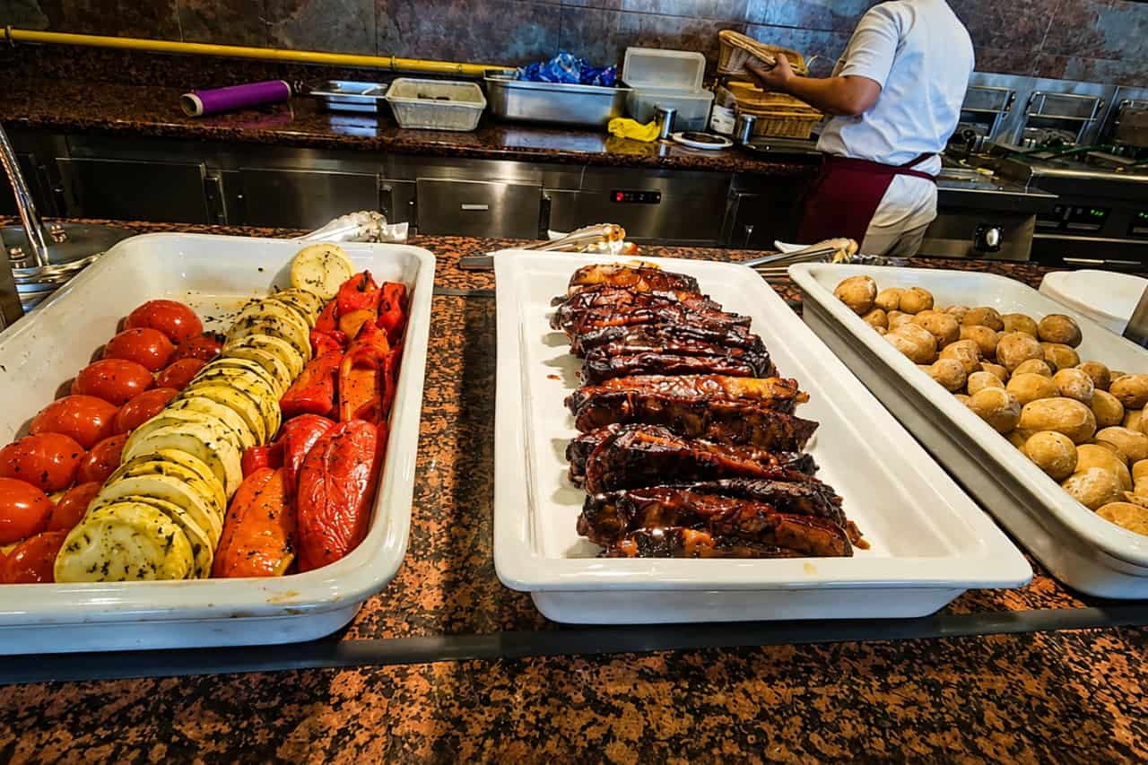 Siam Park all inclusive VIP ticket food selection with grilled meat, vegetables and potatoes.