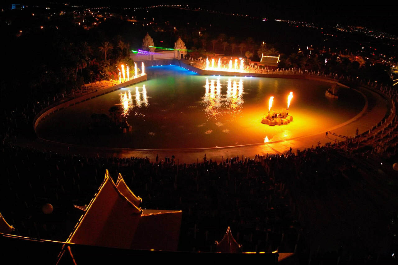 Aerial view of the fire fountains and laser show over the wave pool at Siam Park Night in Tenerife
