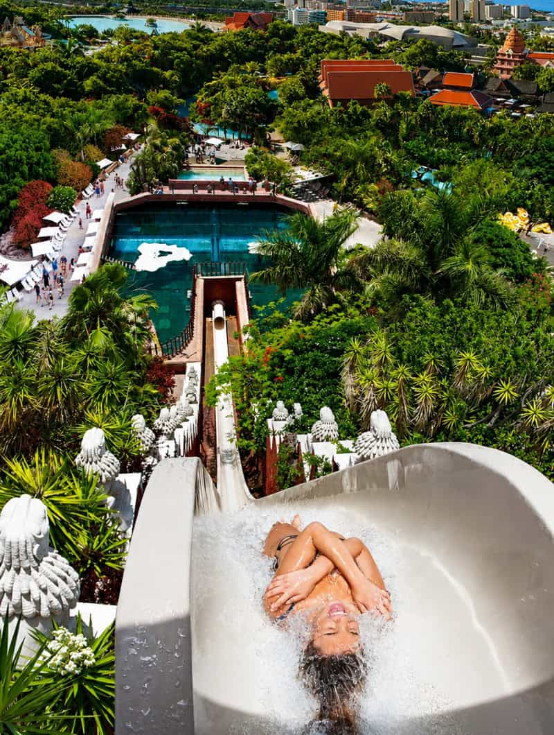 Guest sliding down Tower of Power at Siam Park with ocean view