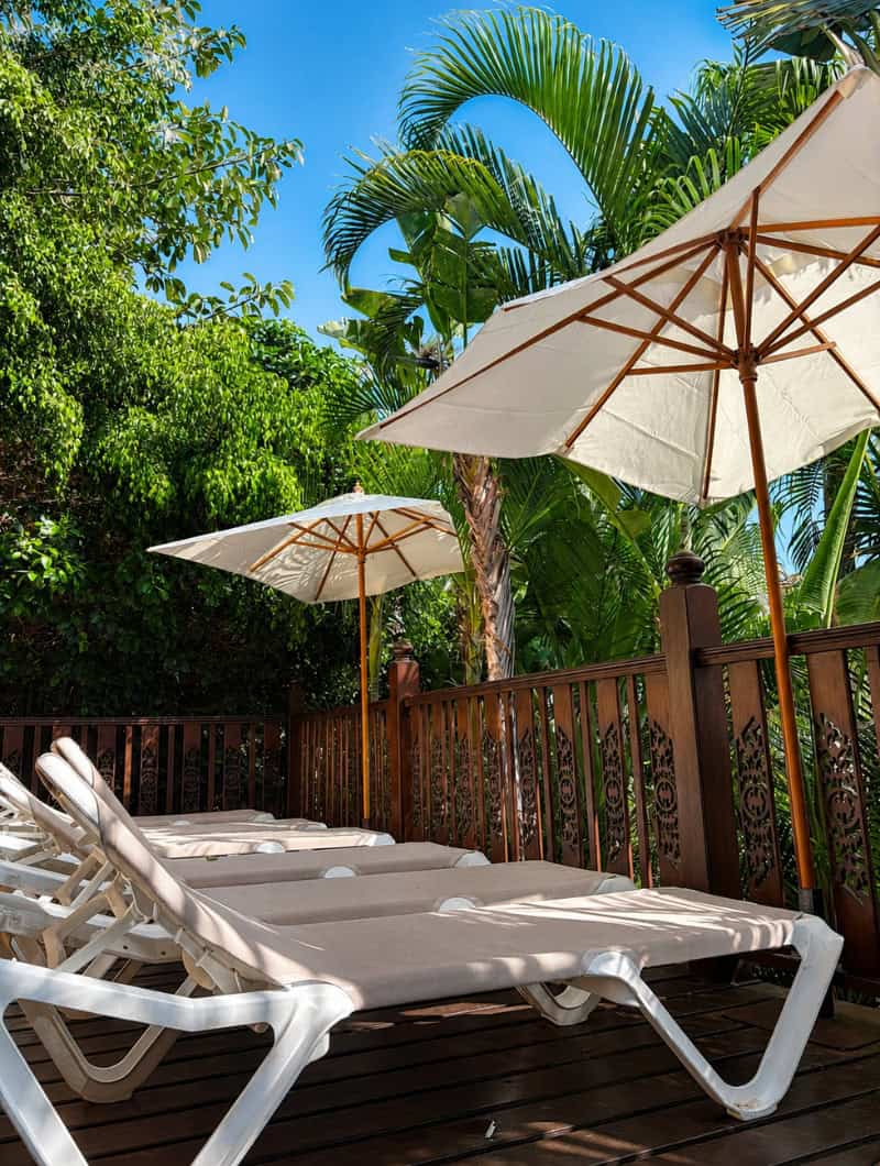 Private sunbeds and umbrellas on the terrace of the Siam Park House in Tenerife