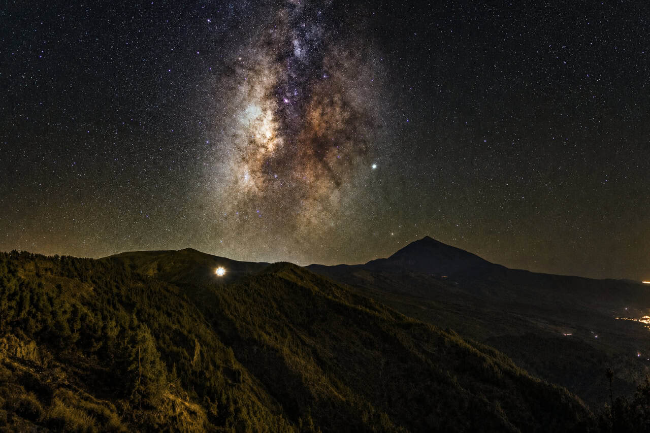 Milky Way over the road through Teide National Park at night in Tenerife