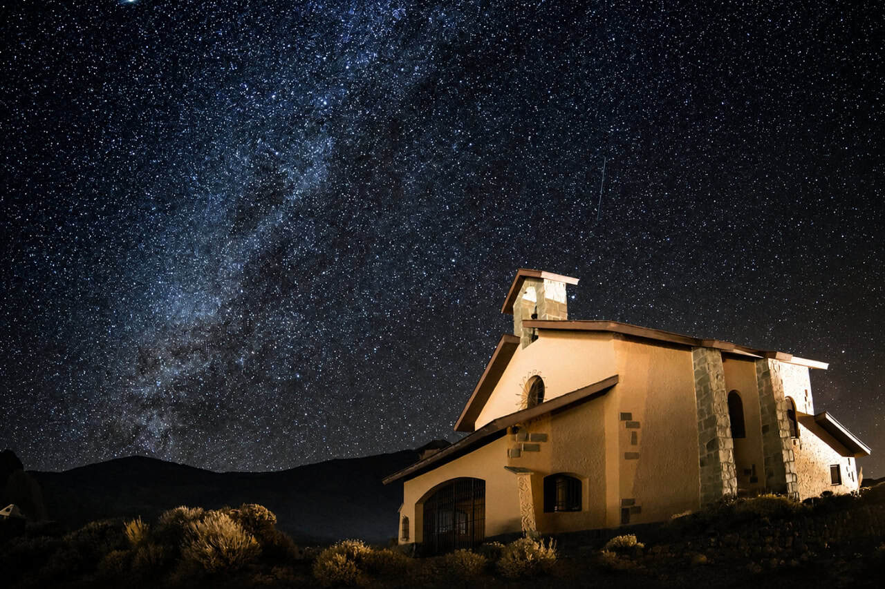 Guest under the Milky Way during a Teide by Night stargazing tour in Tenerife