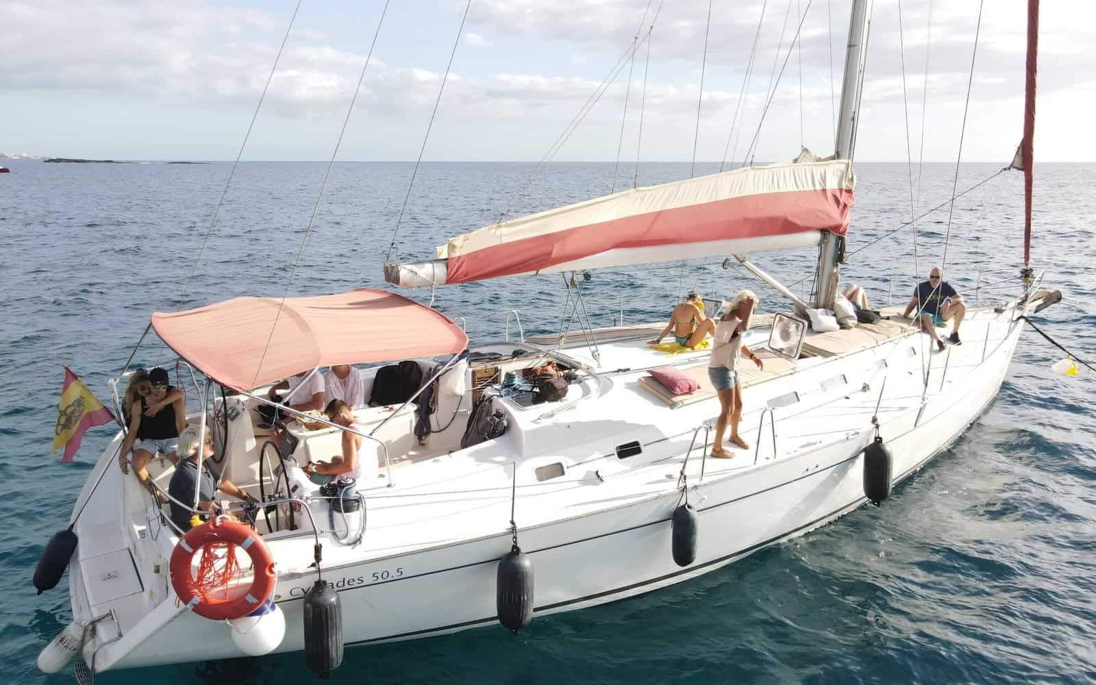 Guests relaxing on a sailing yacht during a whale watching trip in Tenerife