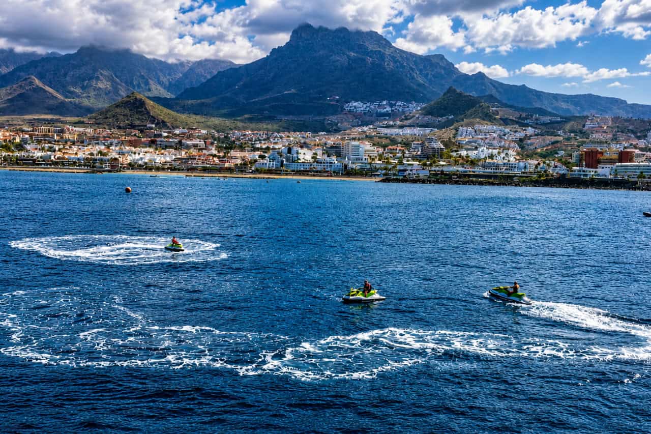Two-hour Tenerife Jet Ski Safari with riders exploring the coastline and enjoying panoramic mountain and ocean views.