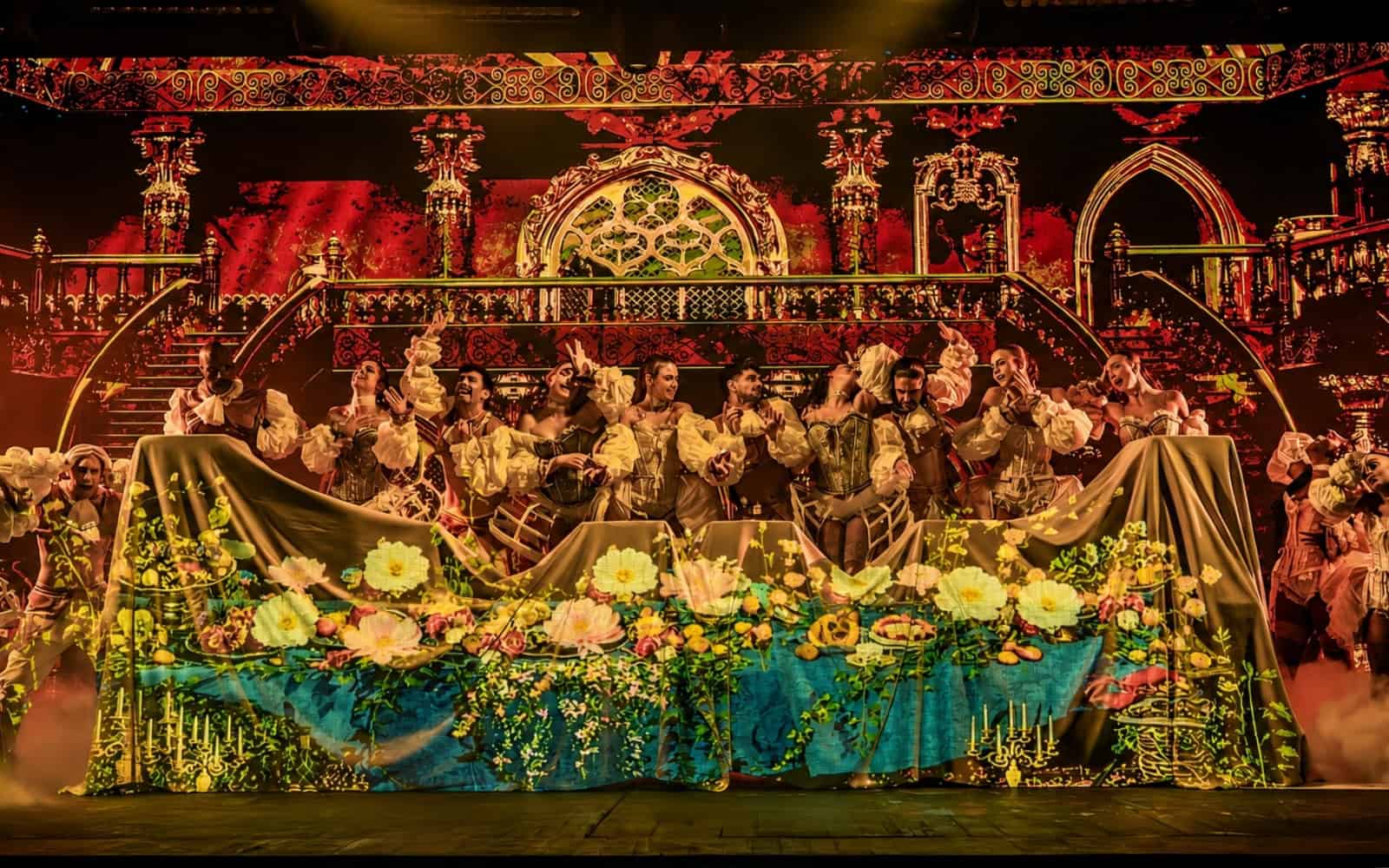 Full cast performing on stage during a dinner show in Gran Canaria
