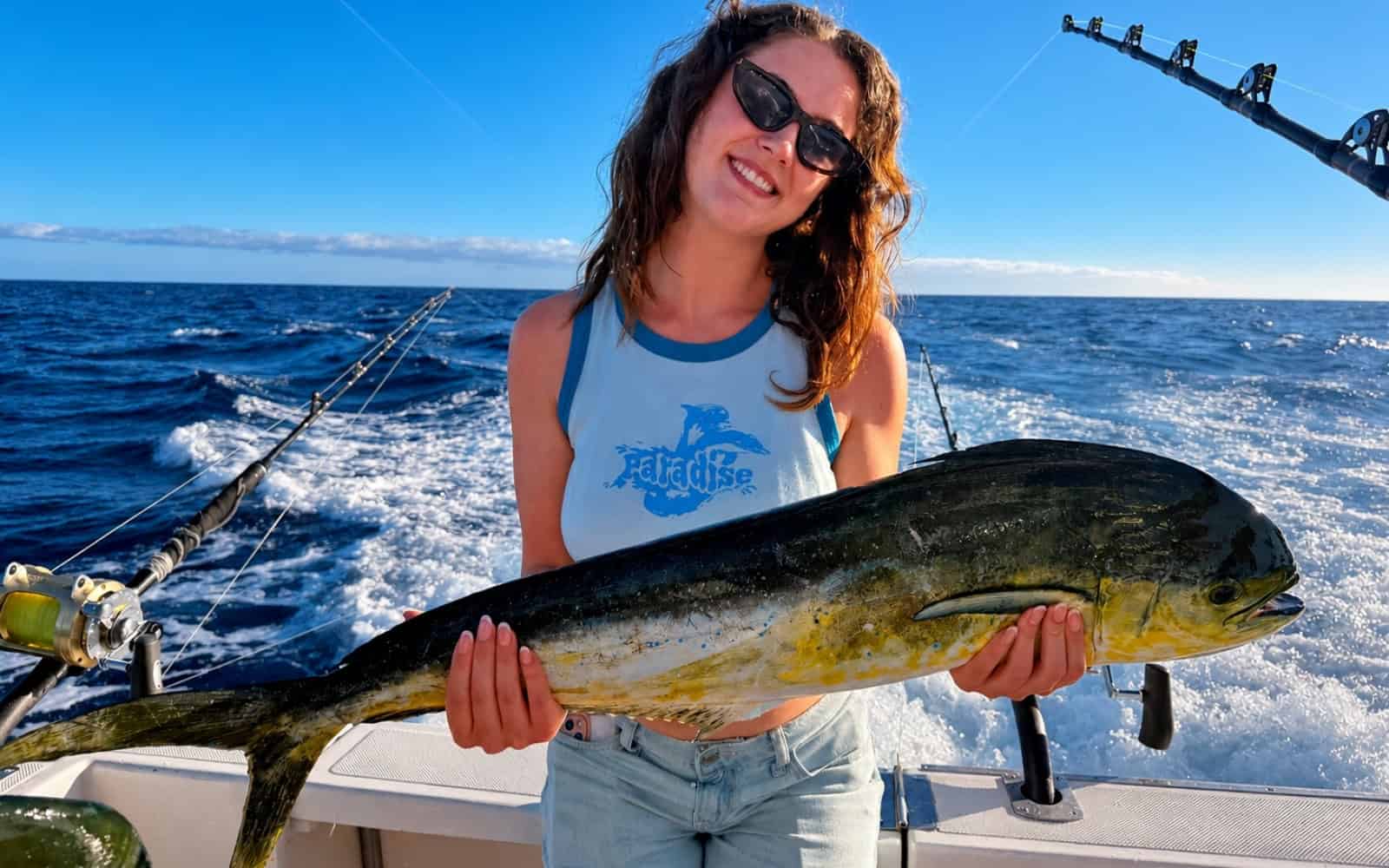 Guest holding a dorado on a fishing boat in Gran Canaria
