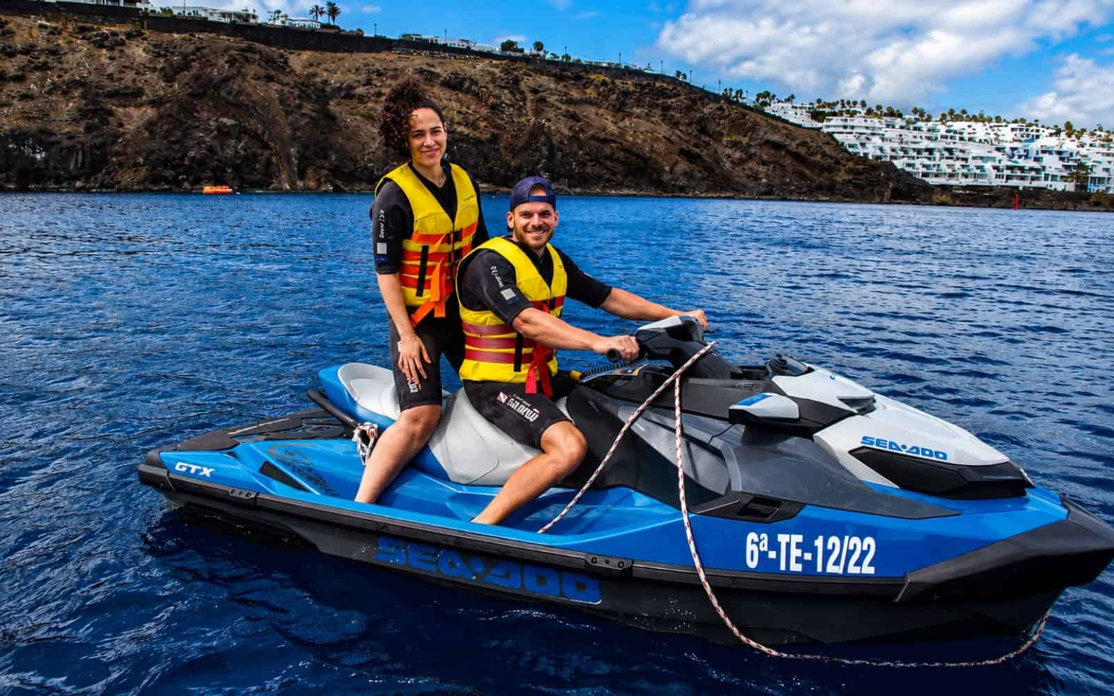 Two guests on a jet ski near the volcanic coast of Lanzarote