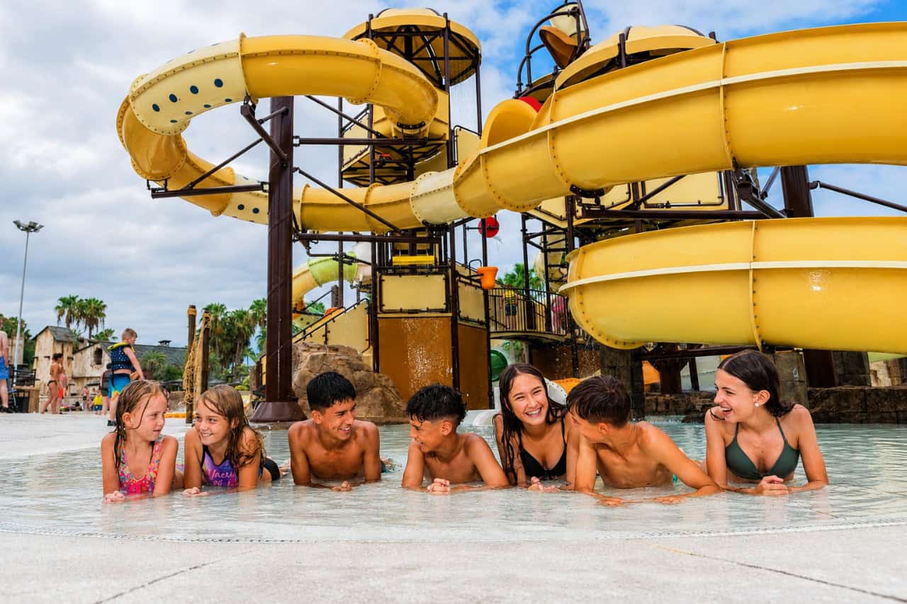 Children relaxing in shallow water at Aqualand Tenerife