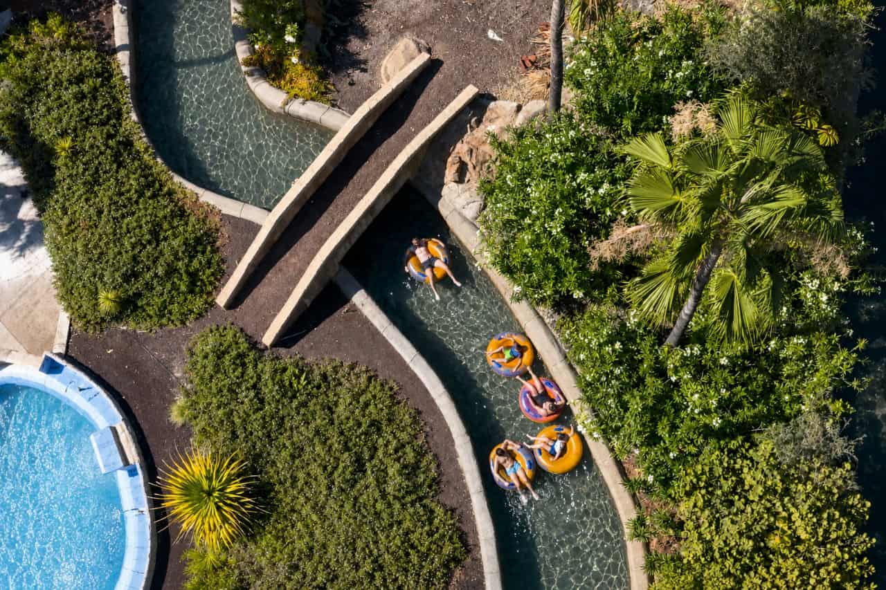 Guests floating on rings along the lazy river at Aqualand Tenerife