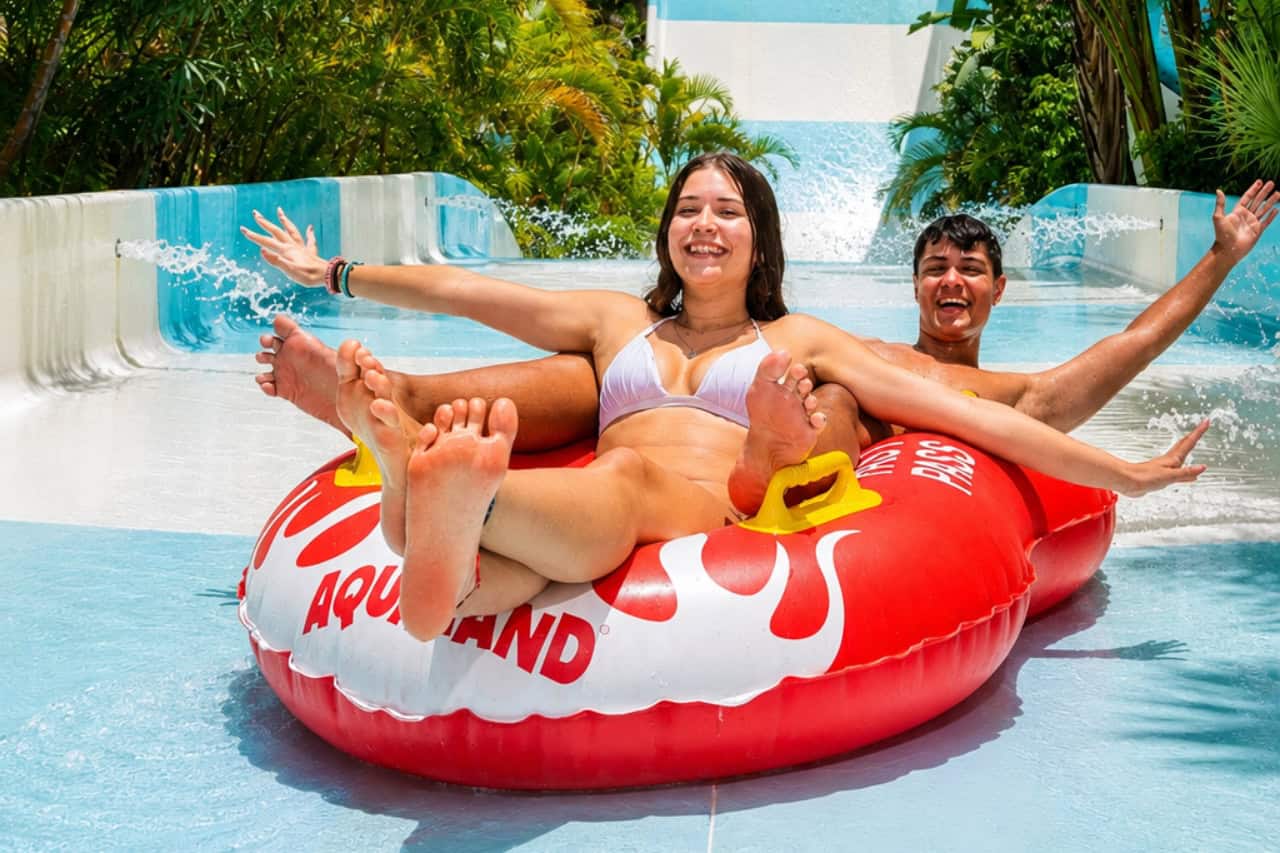 Two guests on a red tube ride at Aqualand Tenerife