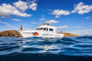 Chill Out Cruise private boat charter sailing along the Lanzarote coast near Playa Blanca.