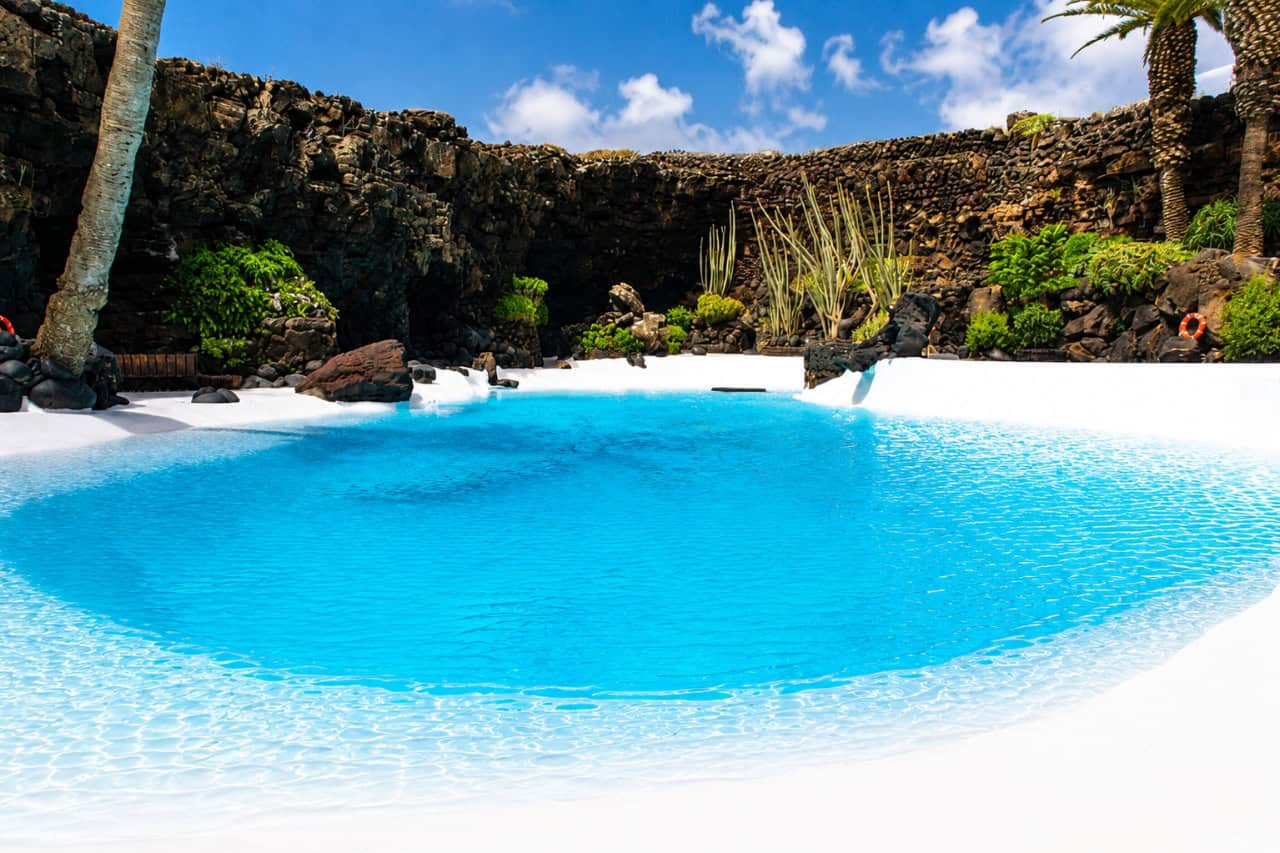 Crystal-clear lagoon inside Jameos del Agua caves in Lanzarote, one of the island's most famous attractions near Cueva de los Verdes.