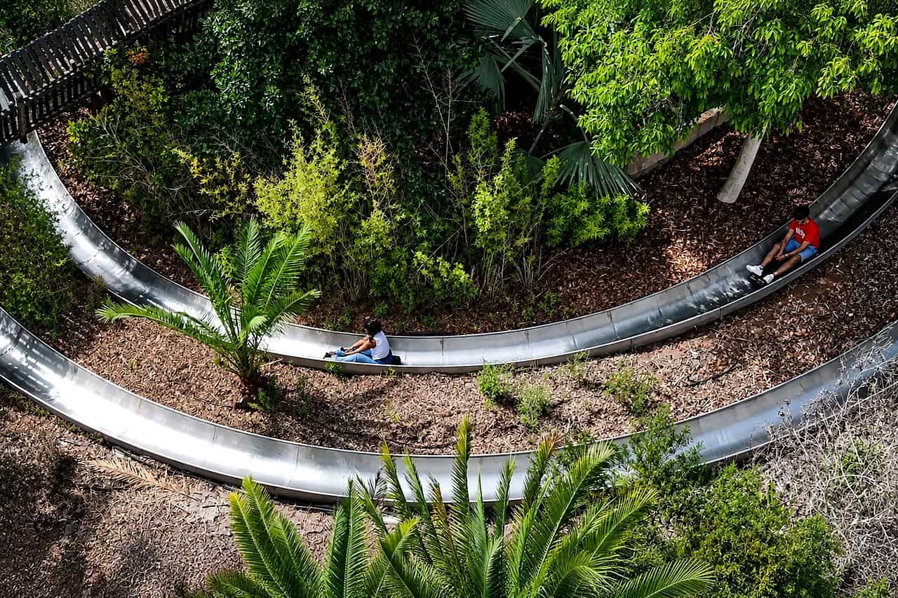 Bobsled ride winding through tropical plants at Jungle Park Tenerife