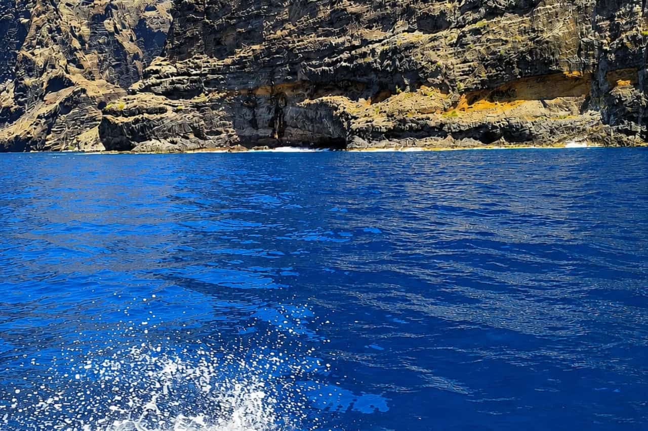 Dramatic Tenerife sea cliffs and deep blue Atlantic Ocean seen during the Shogun Private Boat Tenerife trip.