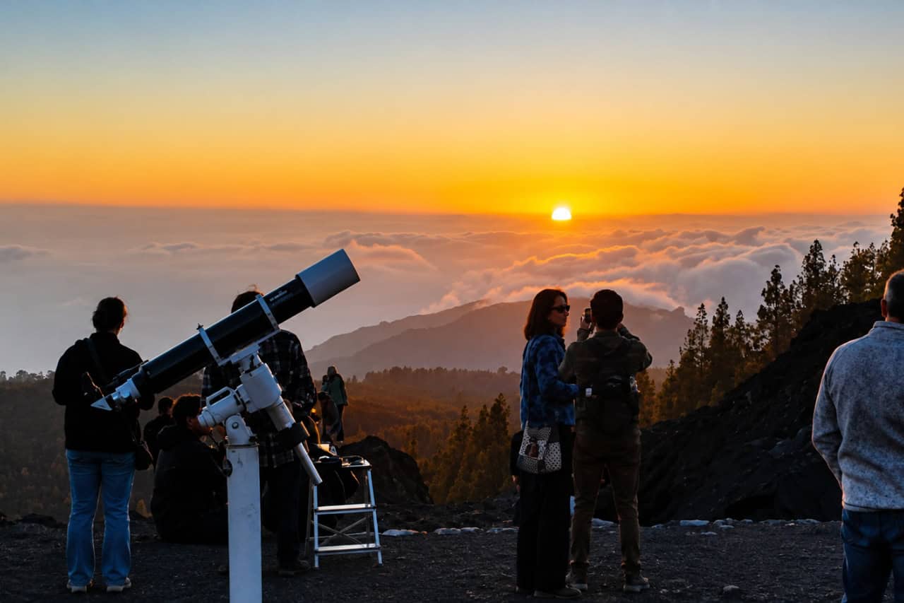 Telescope set up above the clouds at sunset in Teide National Park
