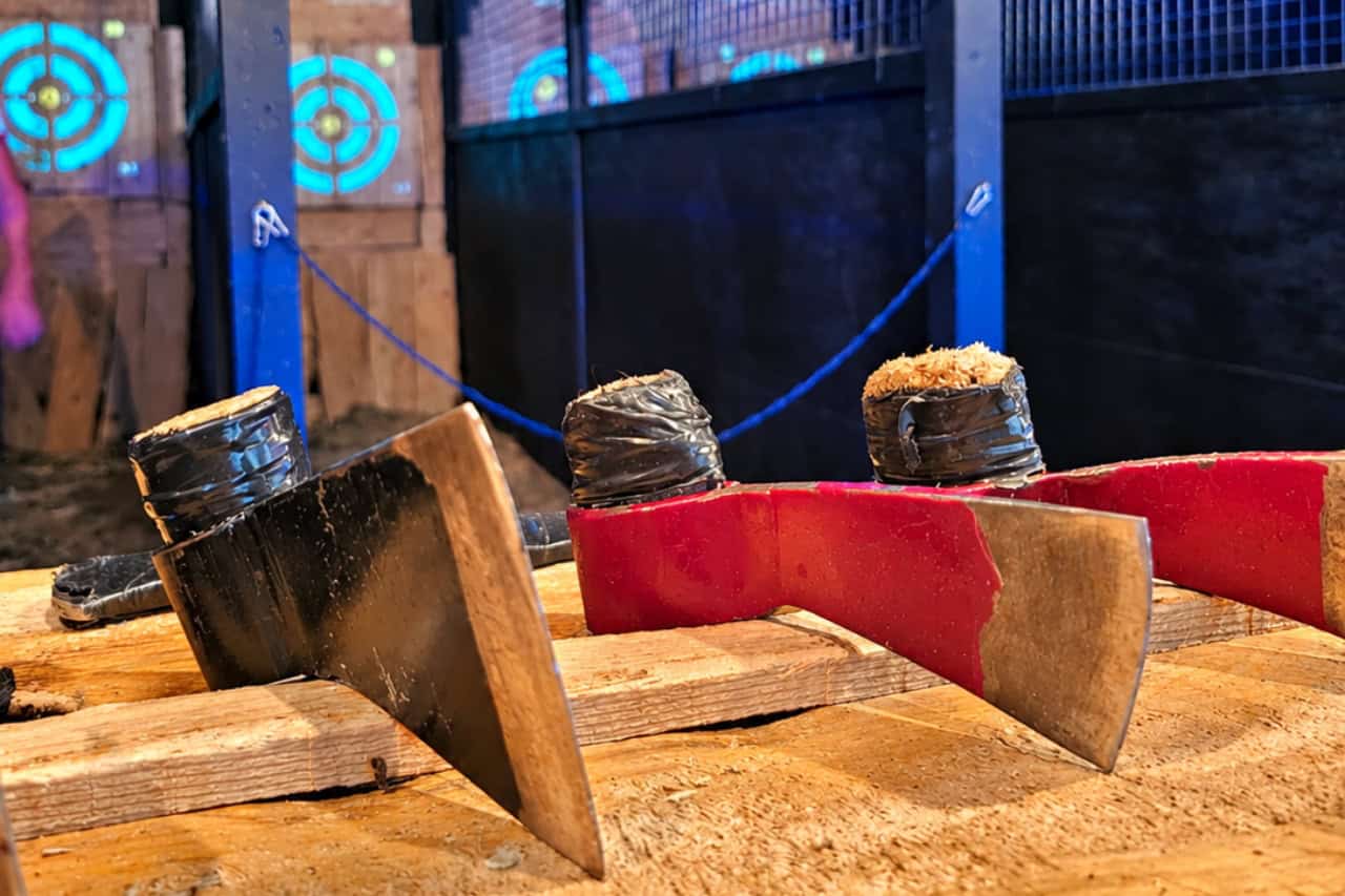 Axe throwing equipment and illuminated targets inside the indoor axe throwing venue in Playa de Las Américas, Tenerife.