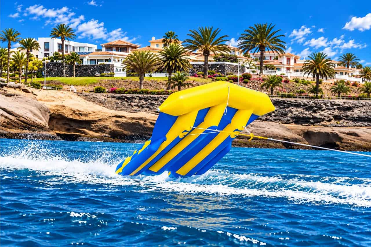 Flying Fish collectible card artwork, the inflatable towed along the Playa de las Américas coast