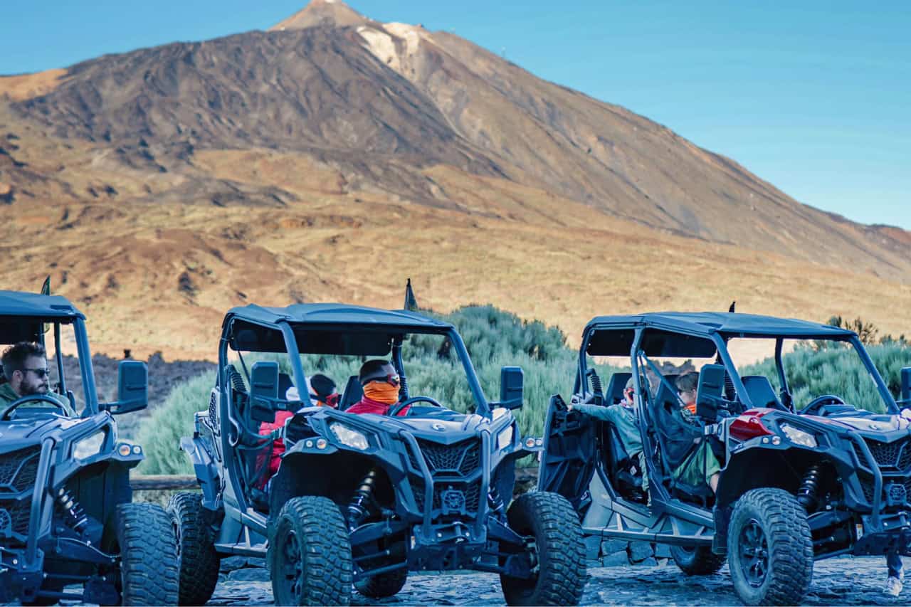 Guests in buggies with Mount Teide in the background