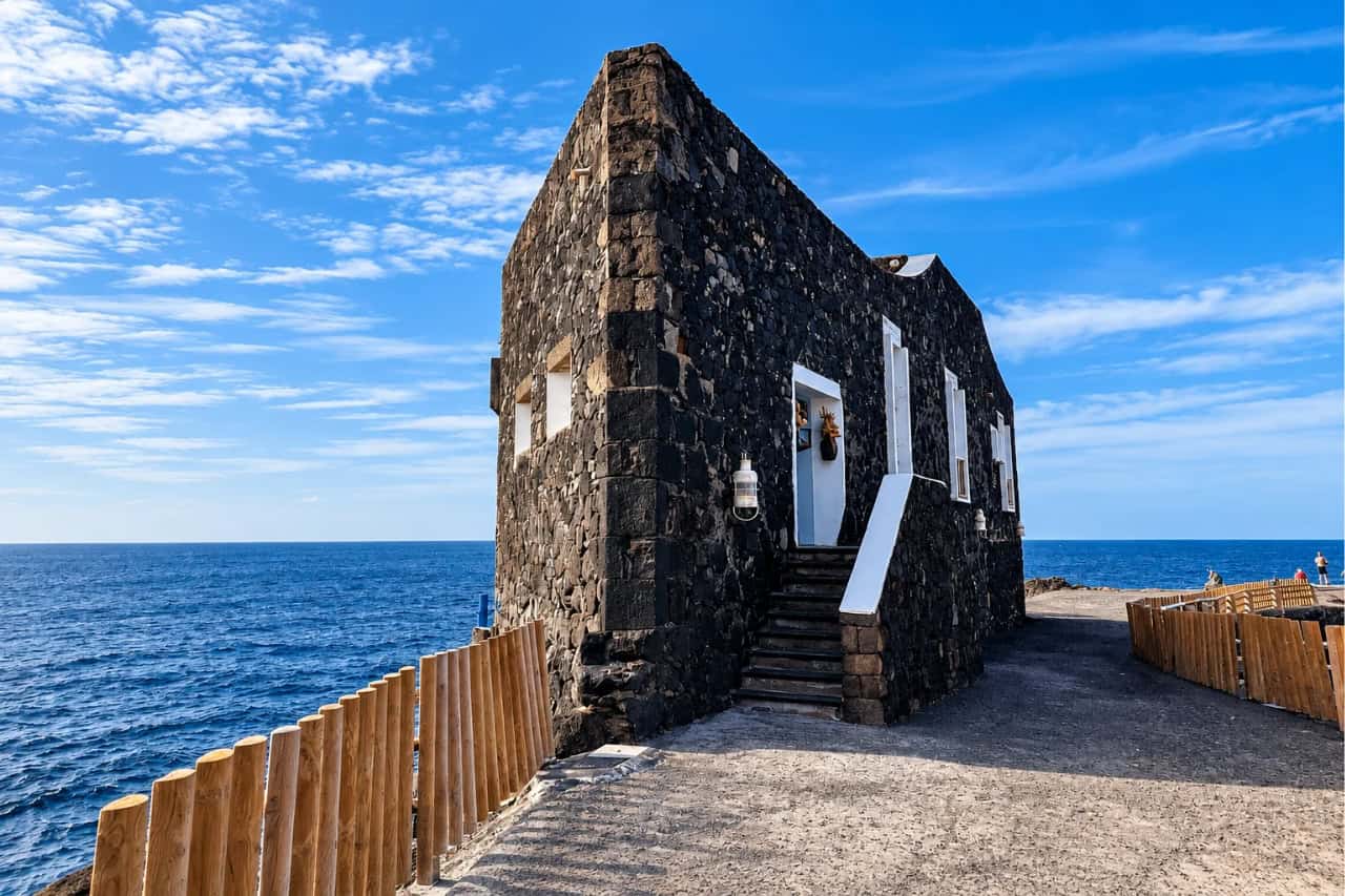 Old volcanic stone building at Punta Grande on the El Hierro coast