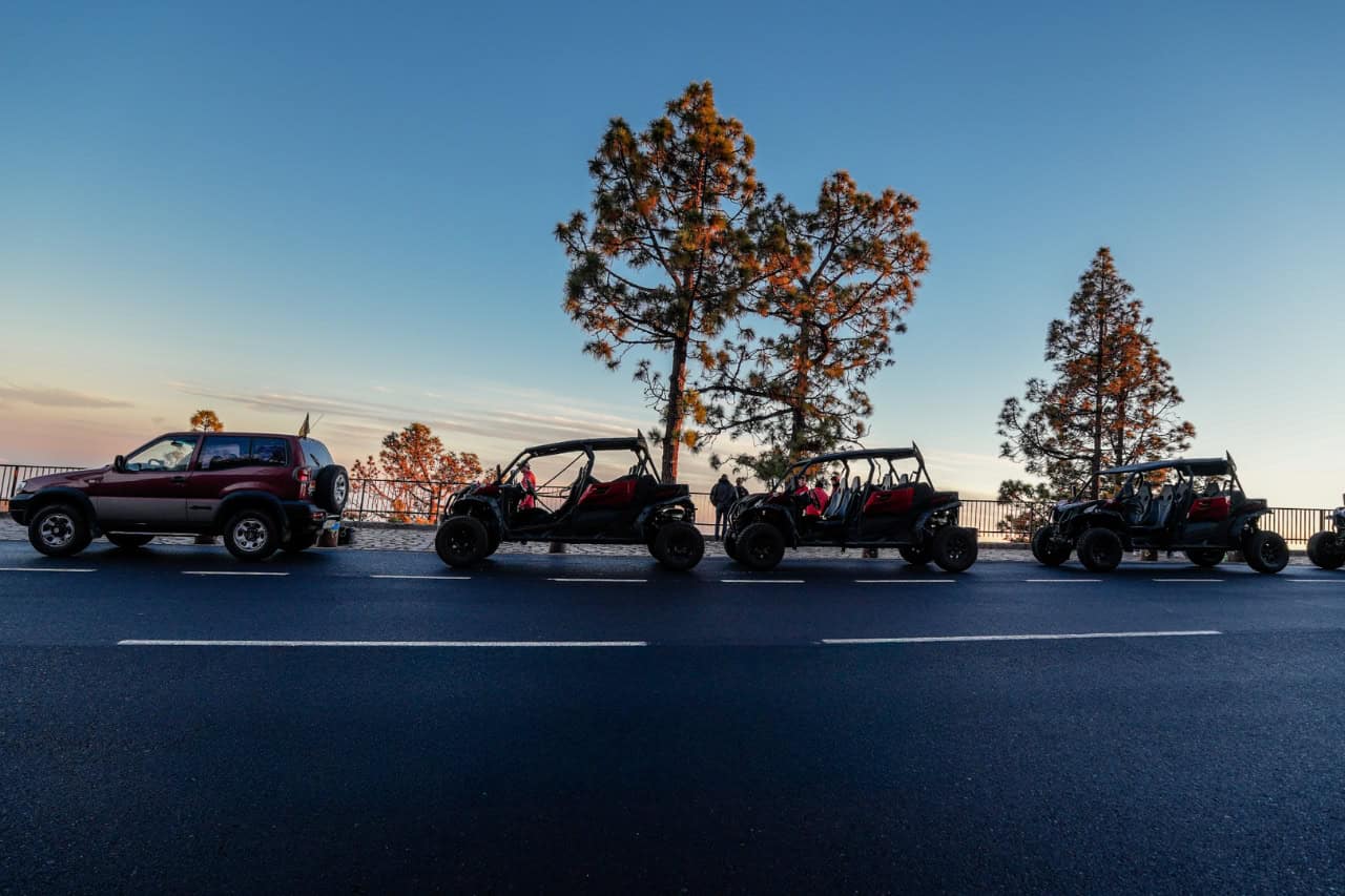 Buggies lined up on a mountain road during the guided tour