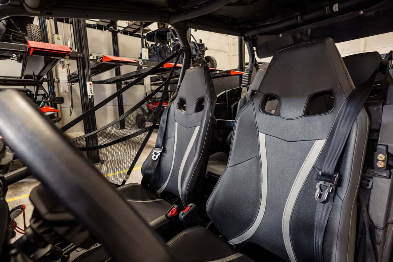 Buggy interior with passenger seats and safety belts