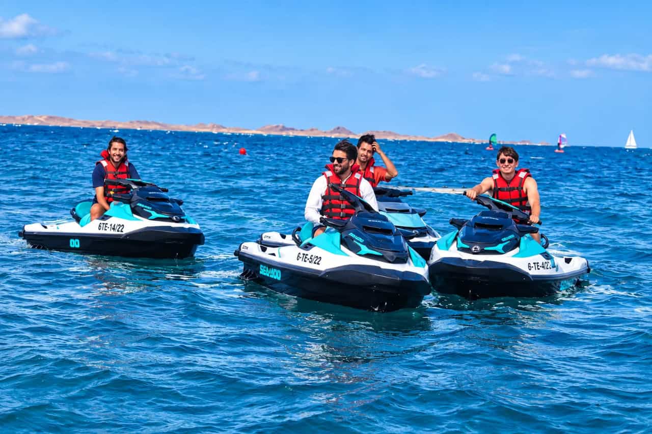 Group of riders in life jackets crossing the Atlantic on jet skis