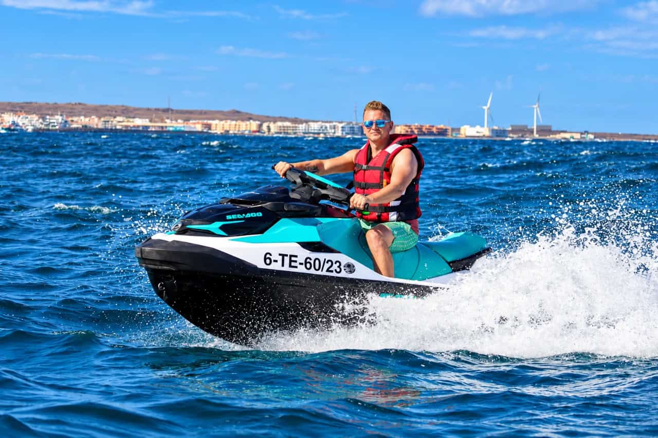 Rider speeding across the Atlantic on a jet ski from Corralejo
