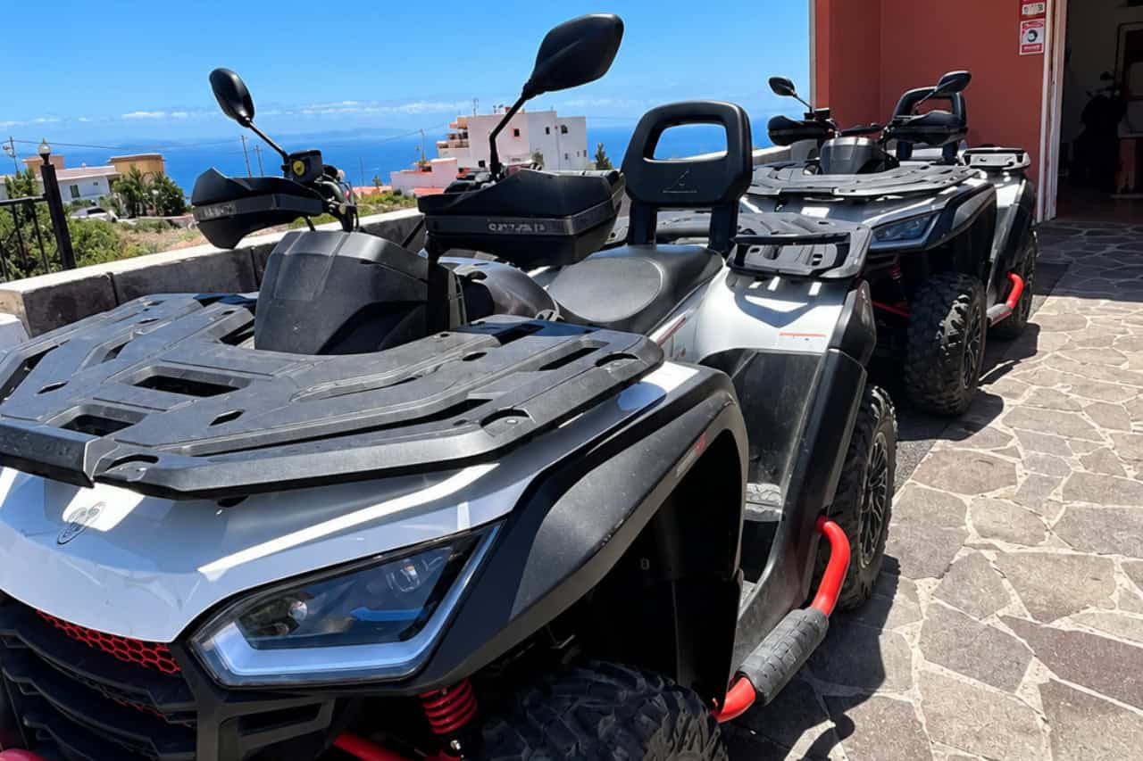 Riders on 500cc quads with Mount Teide in the background