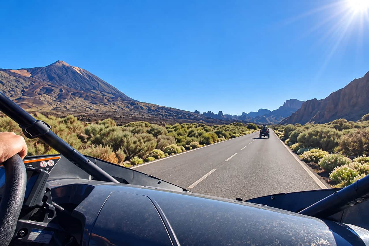 View from the driver seat of a buggy on the mountain road towards Mount Teide